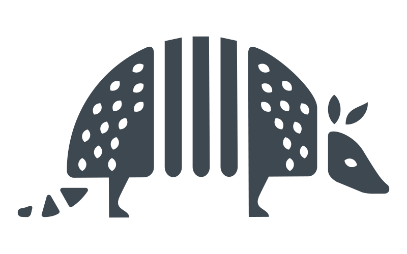 A minimalist, dark gray icon of an armadillo viewed from the side.