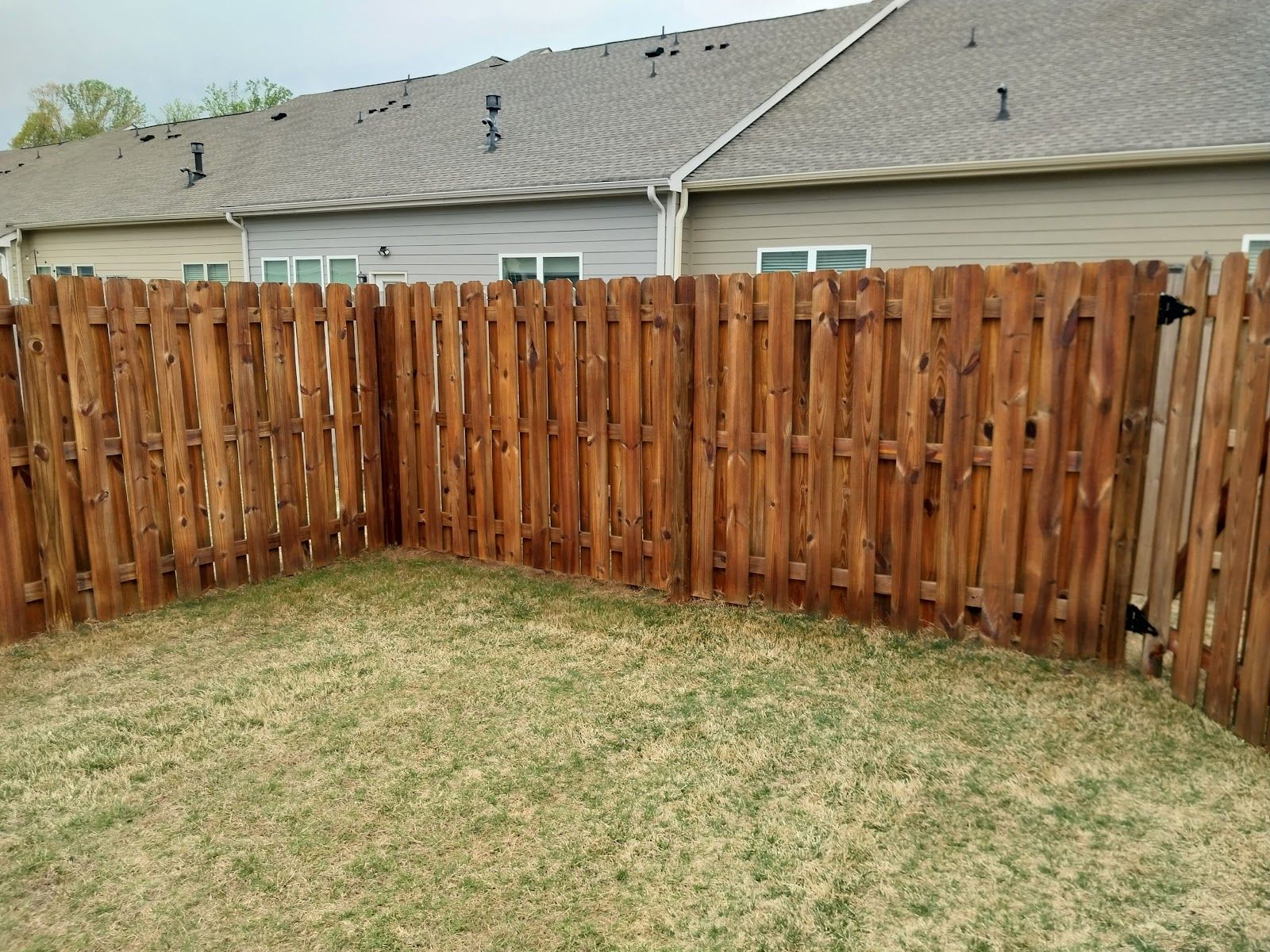 Cedar vs vinyl fence close-up