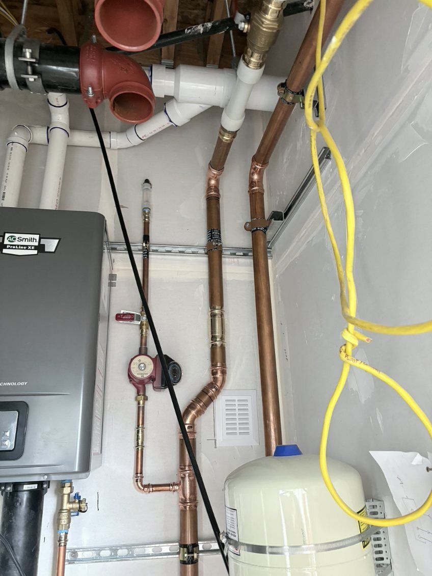 Utility room plumbing with water heater, copper pipes, electrical panel, and hanging yellow cord.