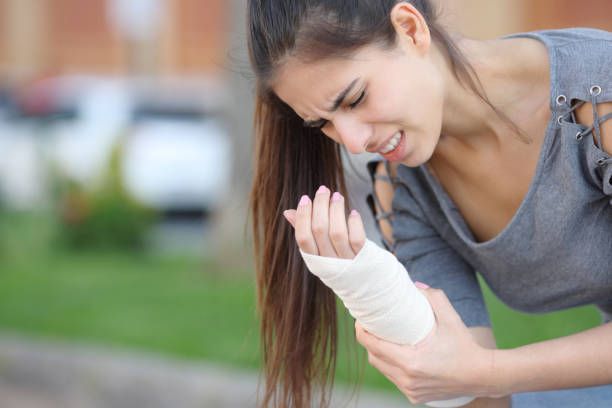 Sunrise Hospital. Patient-133, stock photo of a woman in pain due to a broken wrist Sunrise Hospital. Patient-133, stock photo of a woman in pain due to a broken wrist