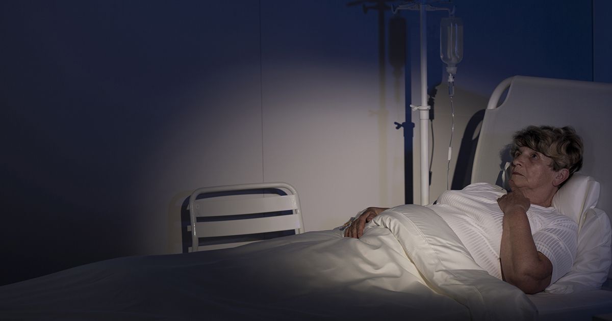 Sunrise Hospital. Patient-211, stock photo of a patient left alone in a dark room in the hospital.