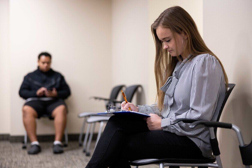 Nevada Orthopedic, Dr. Kevin Laroche, Patient-277, stock photo of patient completing paperwork. Nevada Orthopedic, Dr. Kevin Laroche, Patient-277, stock photo of patient completing paperwork.