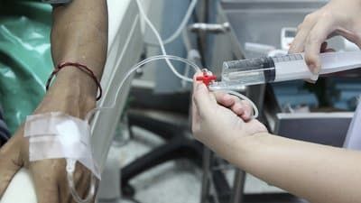 Sunrise Hospital, Patient-285, stock photo of something being injected into a patient's IV.