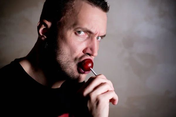 Sunrise Hospital, Patient-348, stock photo of a man sucking on candy.