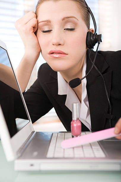 Stock photo of an employee not doing her job, illustrates the poor scheduling practices at Nevada Orthopedic