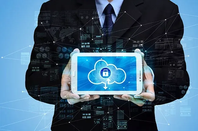 man holding tablet with cloud backup solution image