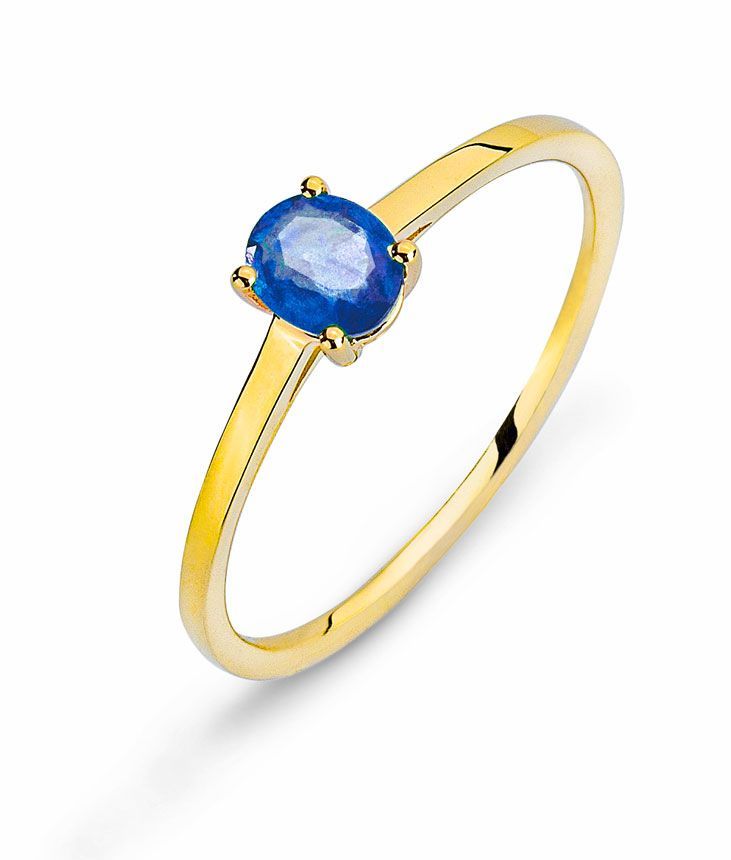 Bague en or ornée d'une pierre précieuse ovale bleue