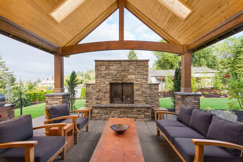 There is a fire pit in the middle of the patio.