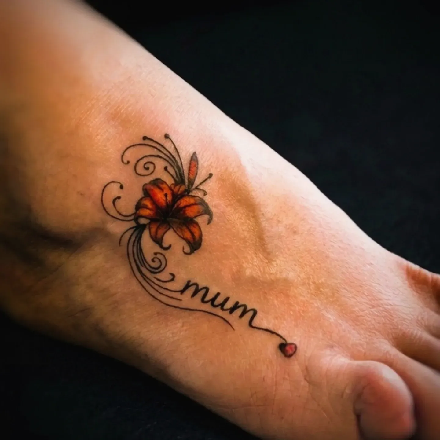 Colour flower and butterfly memorial tattoo.
Tattoo by Thomas at HD Ink Tattoos , Bathgate, West Lothian.