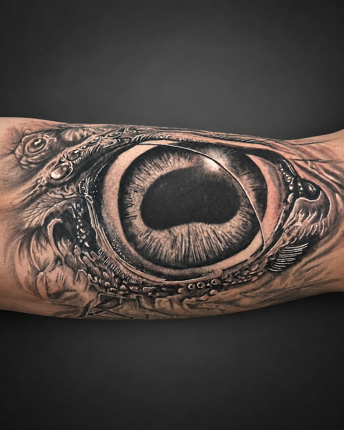 Eye tattoo.
Surreal black & grey design combining  a realistic eye  with intricate mechanical details and organic textures.
Tattoo by Arek at HD Ink Tattoos , Bathgate, West Lothian.