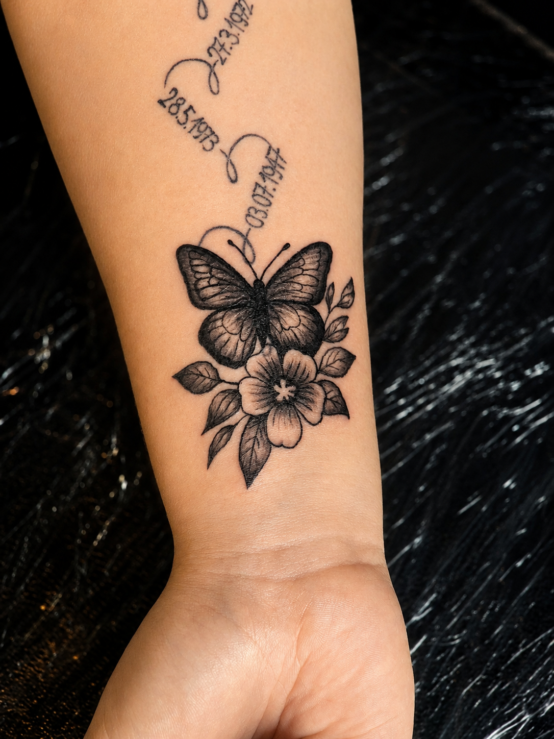 Black & grey butterfly and flower tattoo with memorial dates.
Tattoo by Thomas at HD Ink Tattoos , Bathgate, West Lothian.