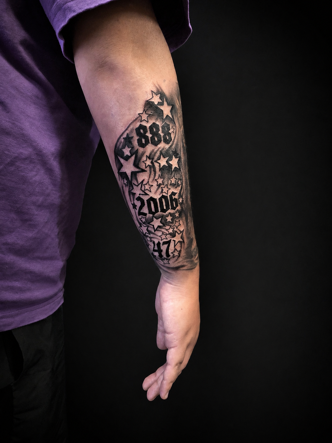Black & grey stars and numbers forearm tattoo.
Tattoo by Thomas at HD Ink Tattoos , Bathgate, West Lothian.