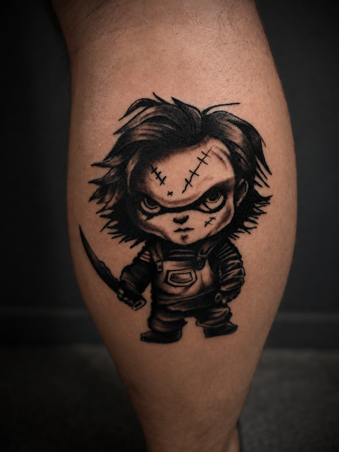 Black and grey Chucky tattoo.
Tattoo by Thomas at HD Ink Tattoos , Bathgate, West Lothian.