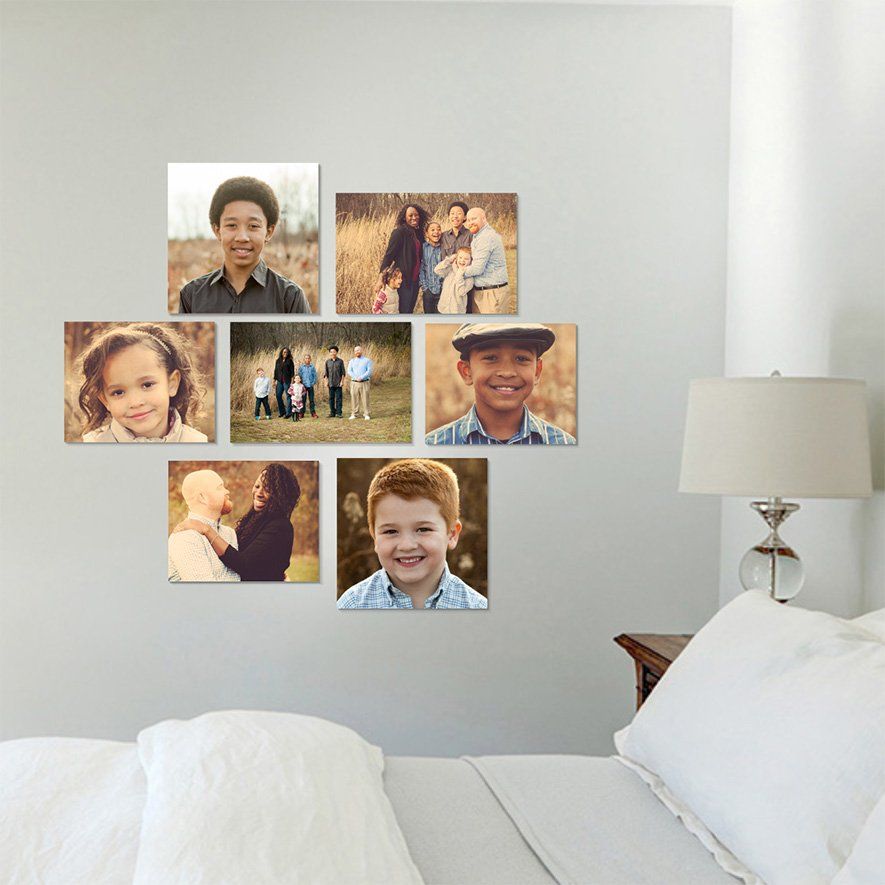 Six small family photos arranged in a collage on a light gray bedroom wall in Carmel Indiana