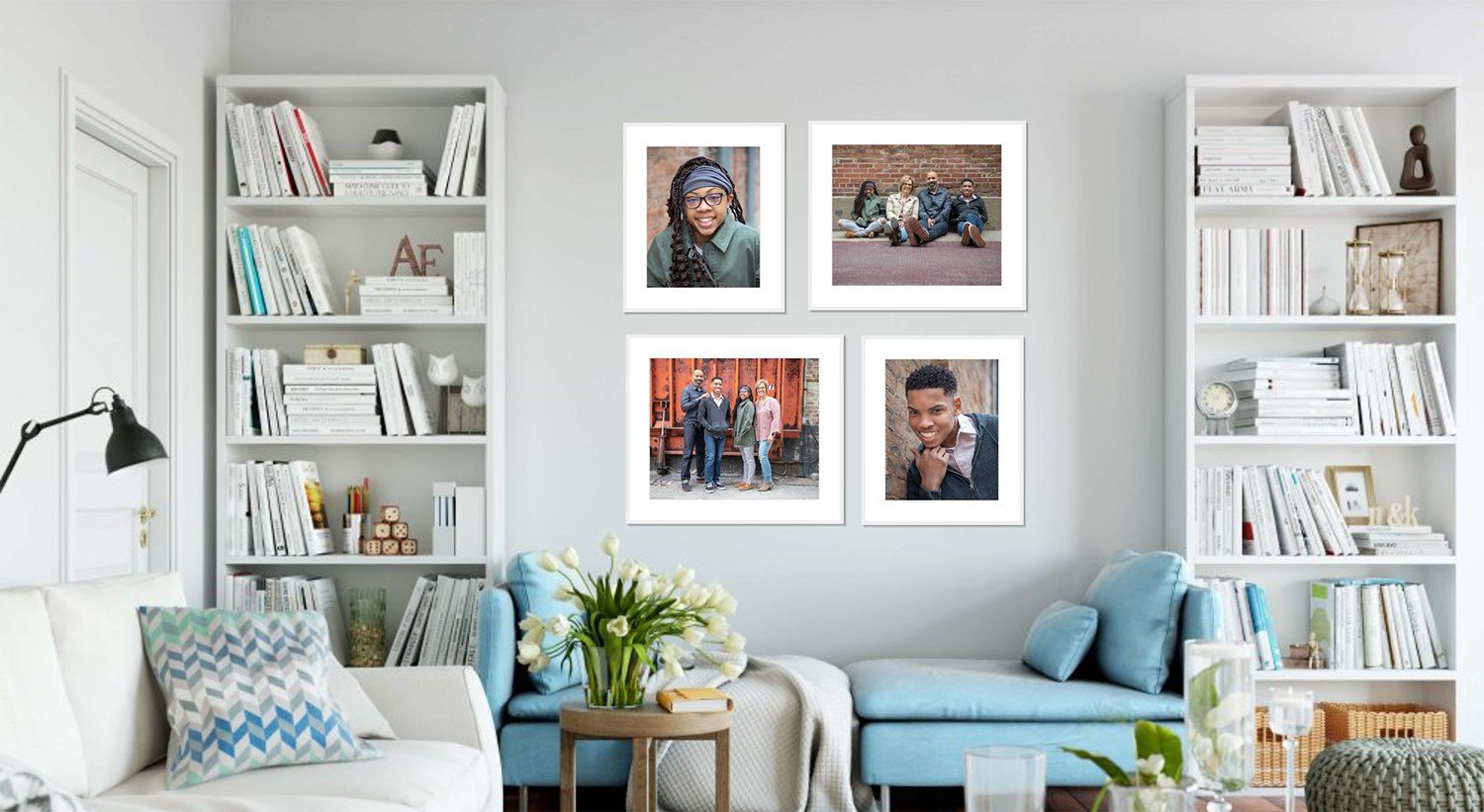 Bright living room with white bookshelves, blue sofa, and framed family art on a gray wall in Fortville, Indiana