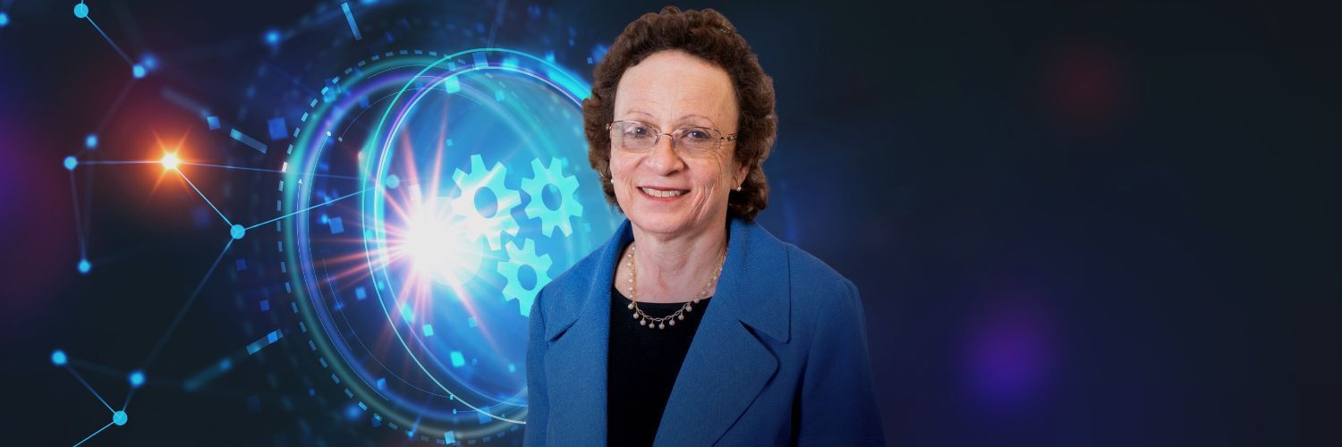 A woman in a blue jacket is standing in front of a futuristic background.