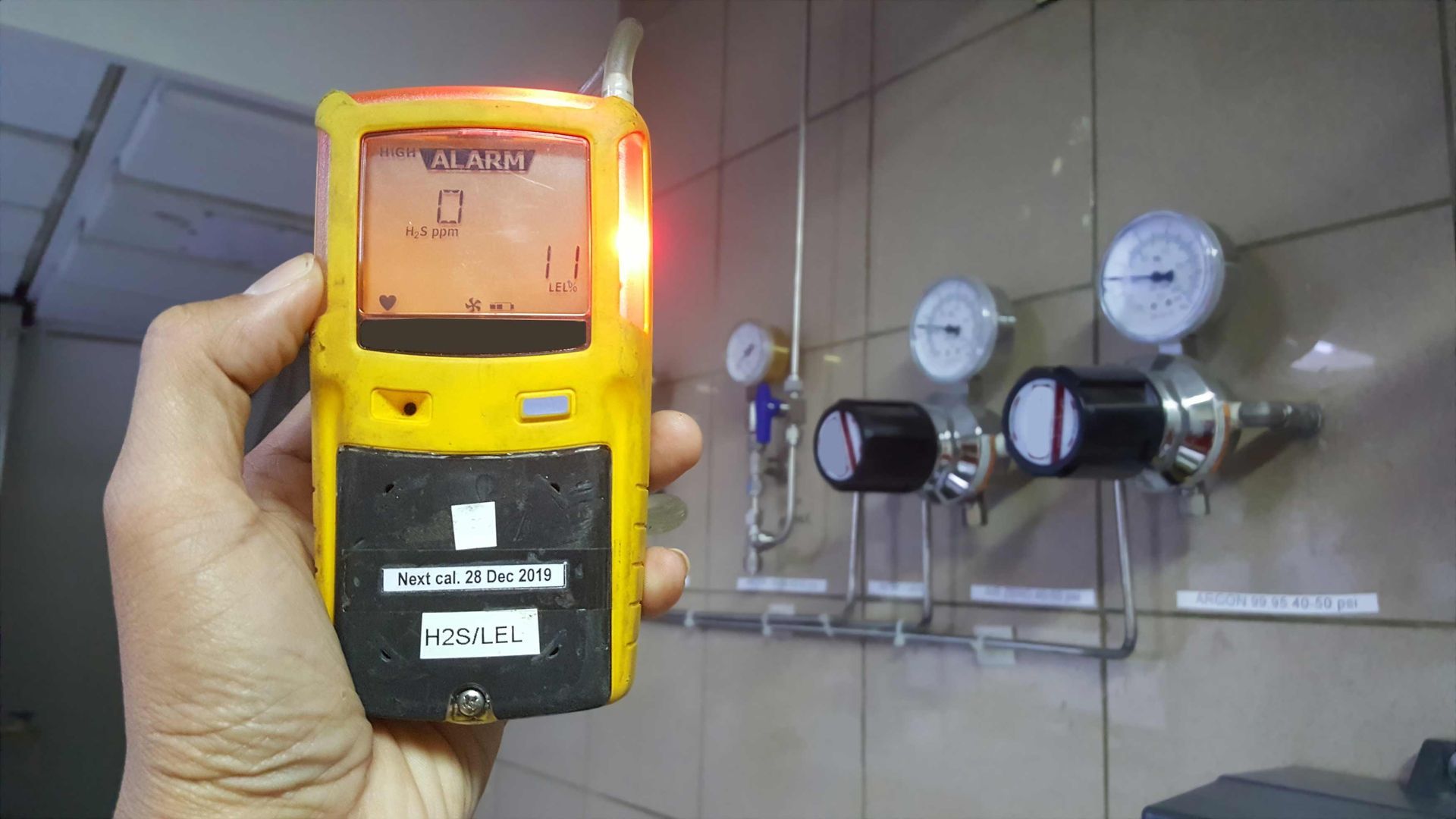 A Person Is Holding A Gas Detector In Their Hand — Rome, GA — Crider Plumbing Co
