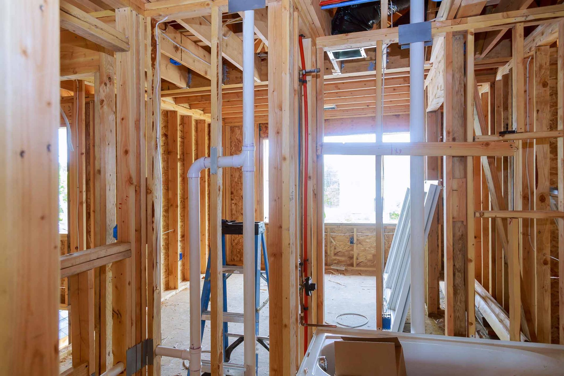 A House Is Being Built With Wooden Beams And Pipes — Rome, GA — Crider Plumbing Co A House Is Being Built With Wooden Beams And Pipes — Rome, GA — Crider Plumbing Co