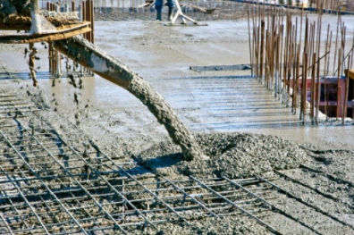 Concrete machine pouring concrete at commercial building in Cheyenne WY.