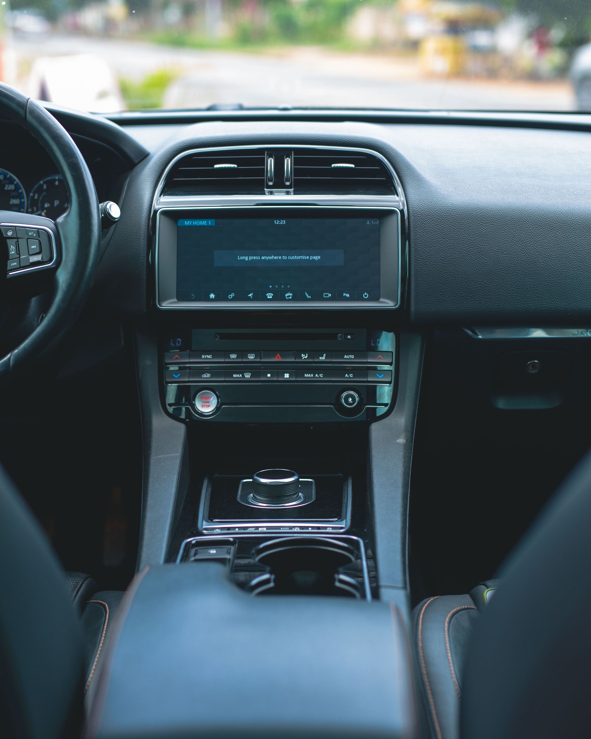 Car interior showing the dashboard, center console, and infotainment screen from the front seats.