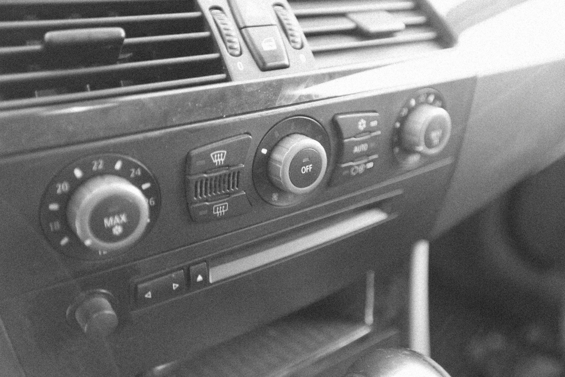A Black And White Photo Of The Dashboard Of A Car — Manning Smash & Auto Repairs In Forster, NSW