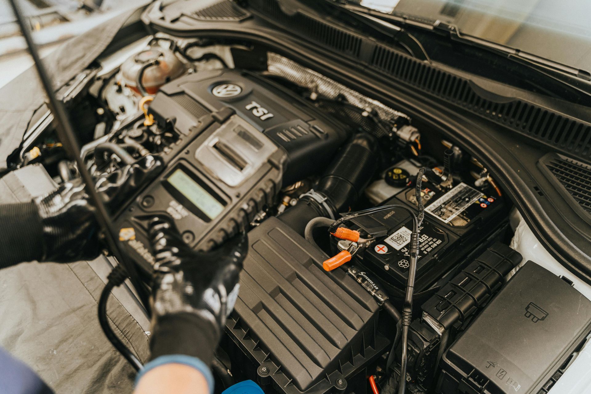 A Person Is Working On The Engine Of A Car — Manning Smash & Auto Repairs In Forster, NSW
