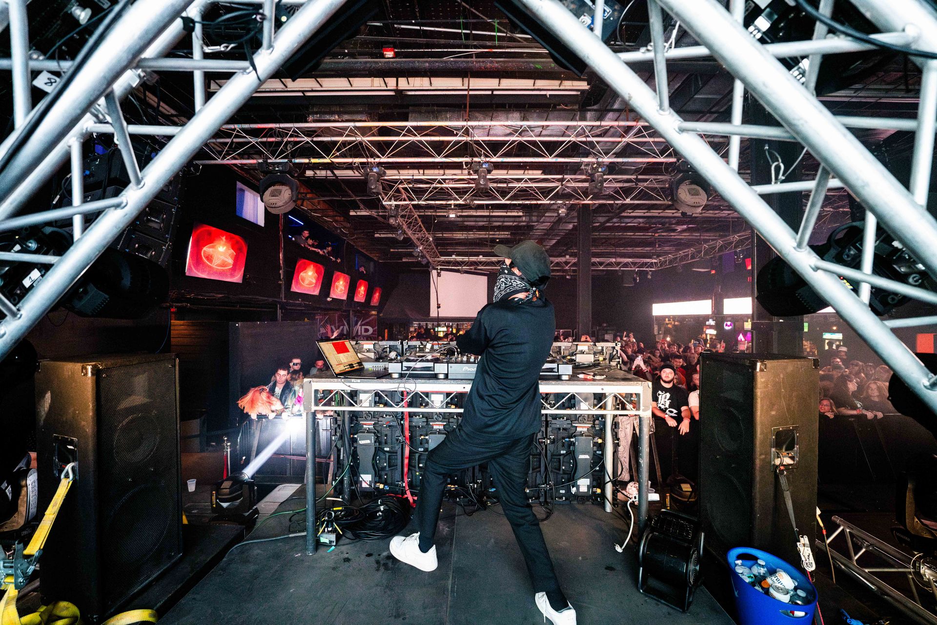 A man is standing on a stage in front of a crowd.