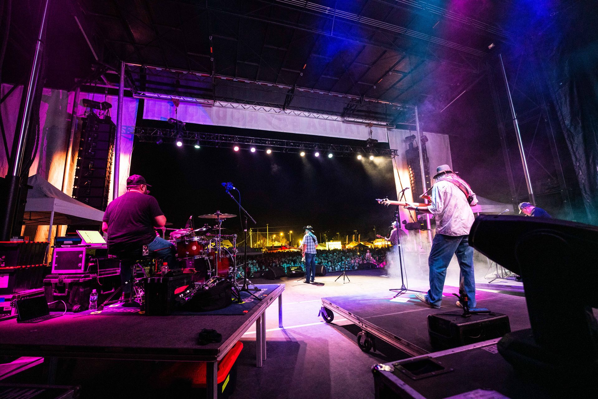 A group of people are playing instruments on a stage.