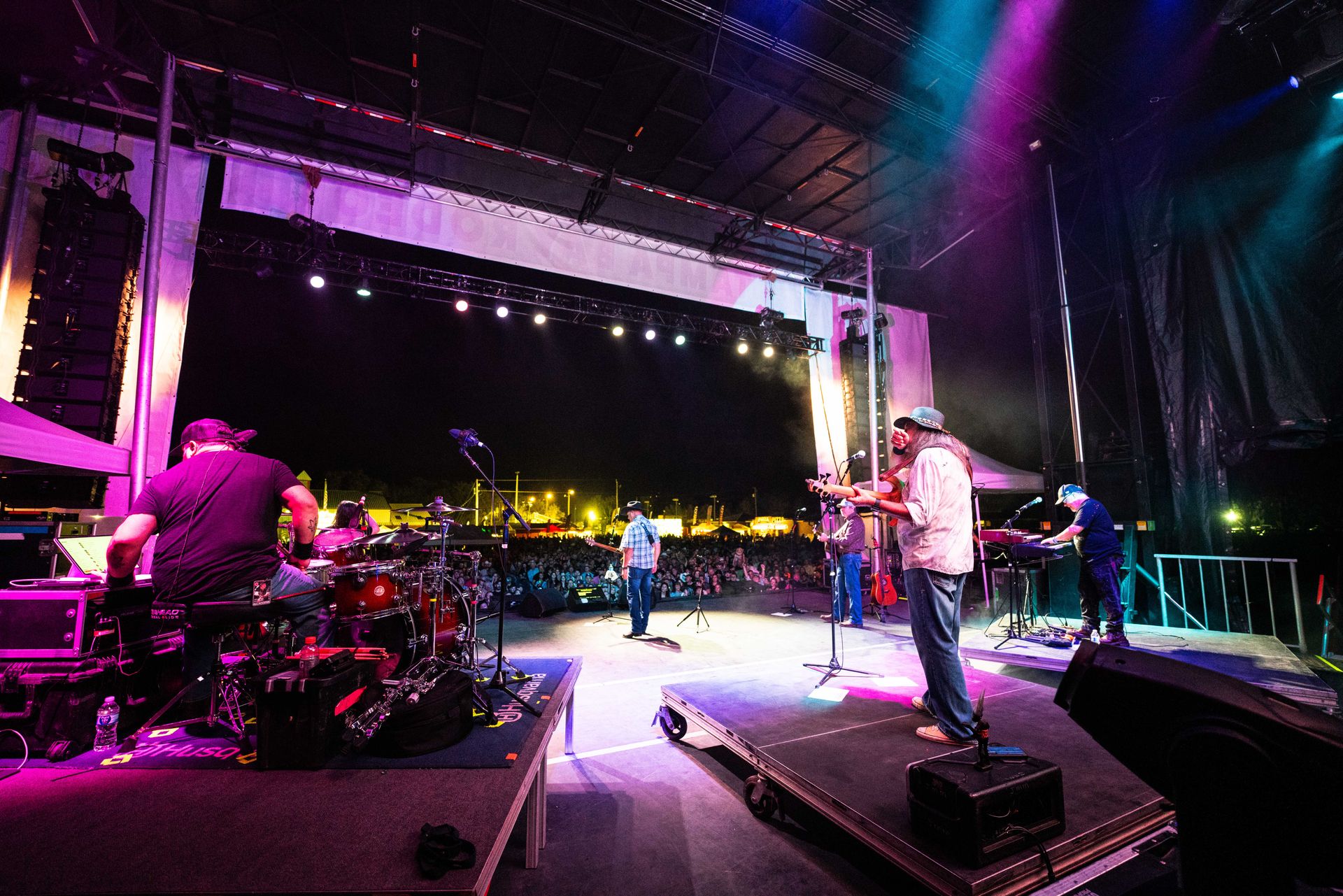 A group of people are playing instruments on a stage.