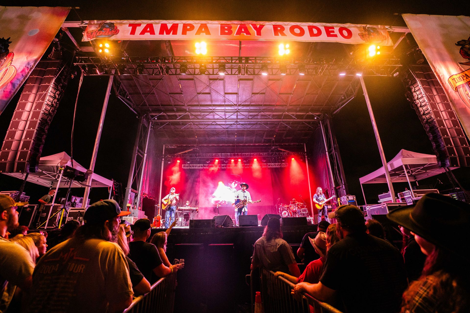 A group of people are watching a concert at tampa bay rodeo