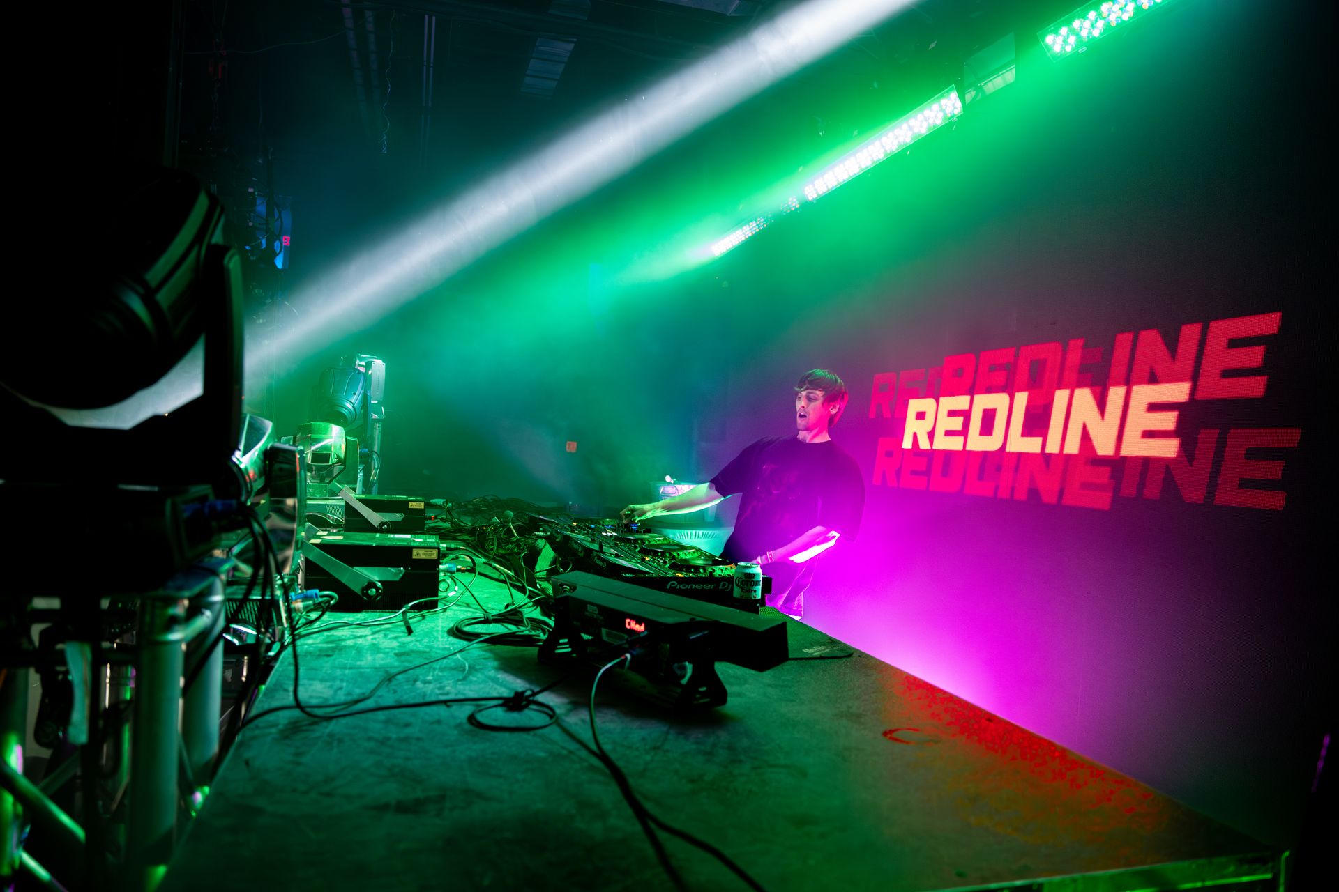 A stage with a lot of lights and the word redline on it