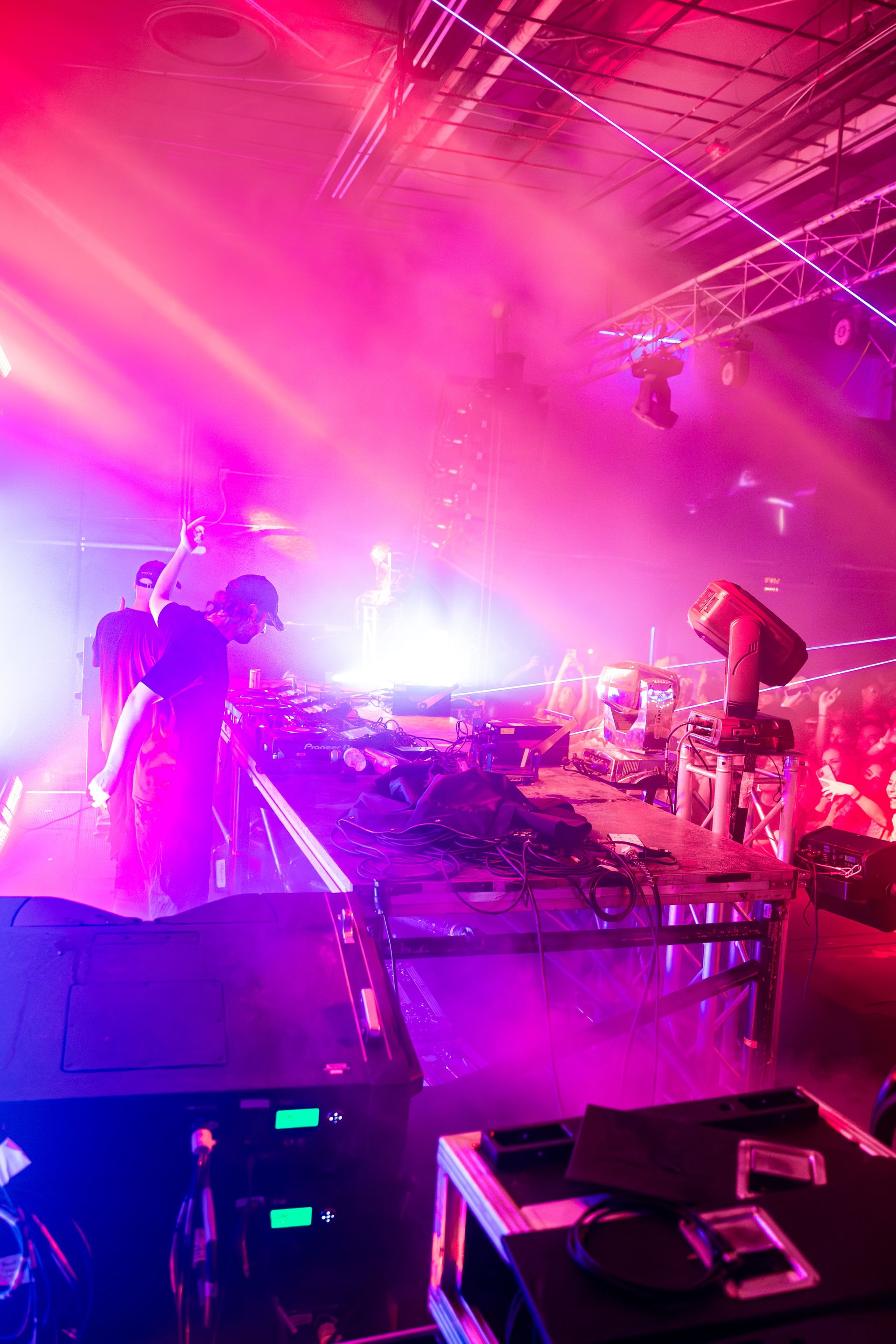 A group of people are playing instruments on a stage at a concert.