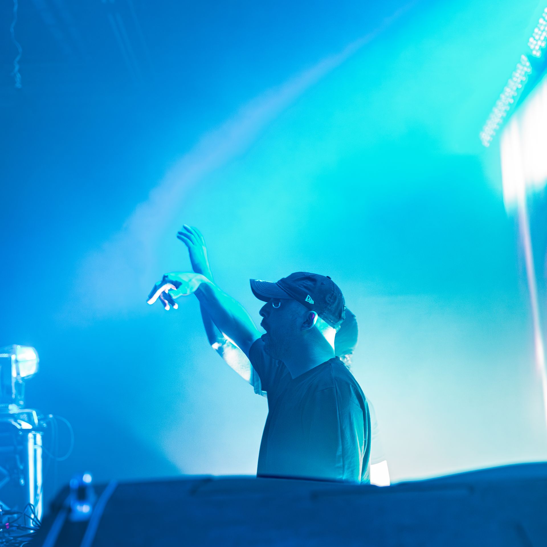A man is singing into a microphone on a stage