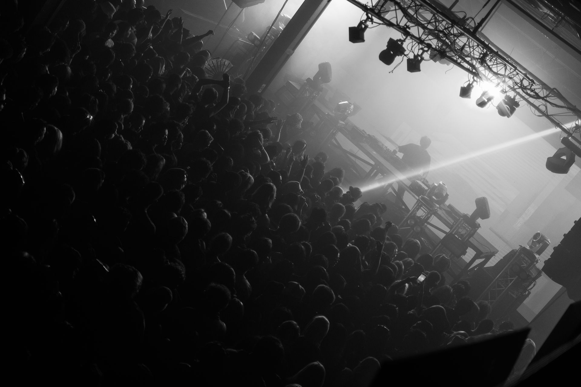 A black and white photo of a crowd at a concert