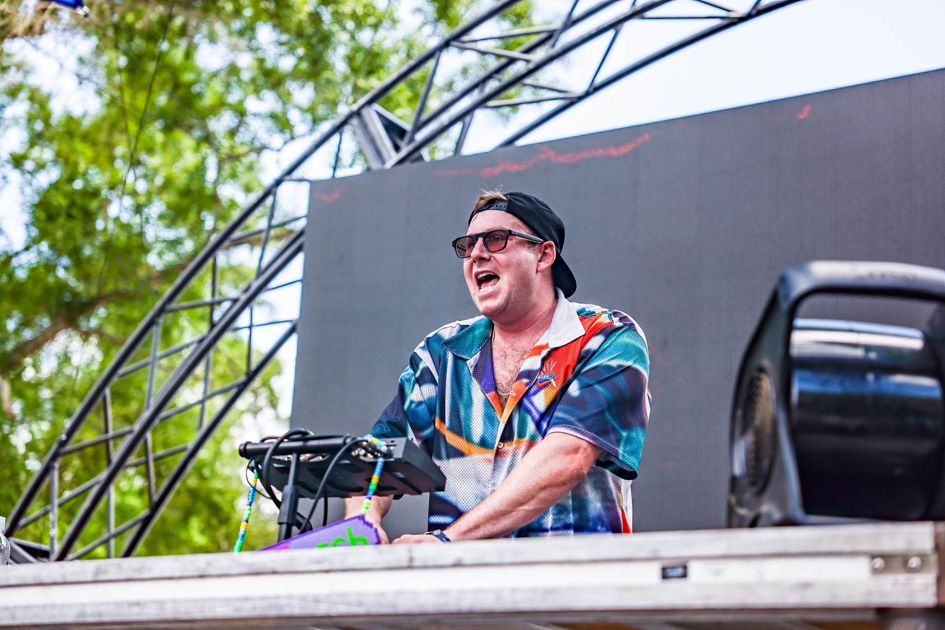 A man is playing a keyboard on a stage.