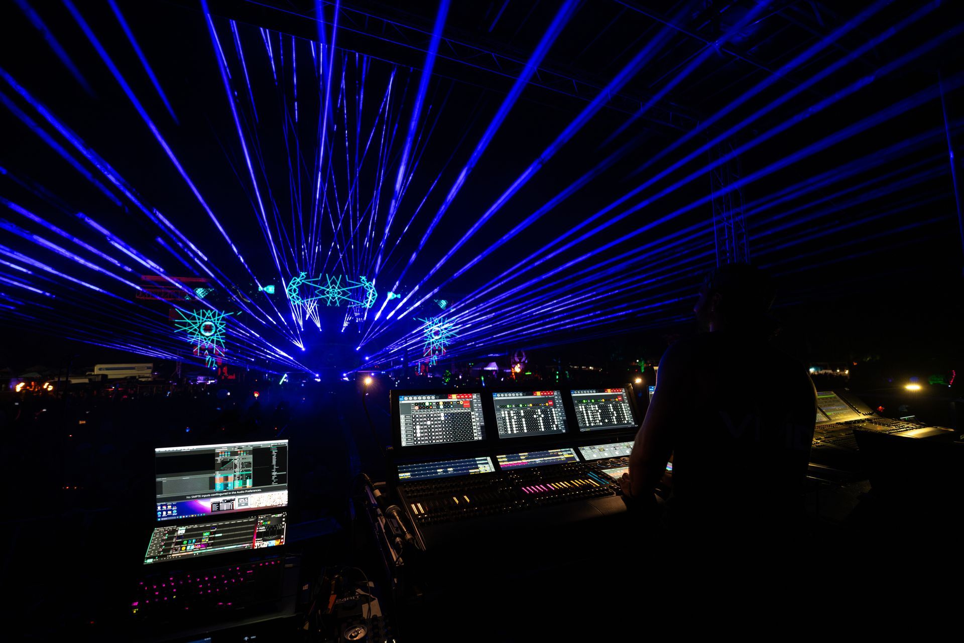 A dark room with a lot of blue lights coming out of the ceiling
