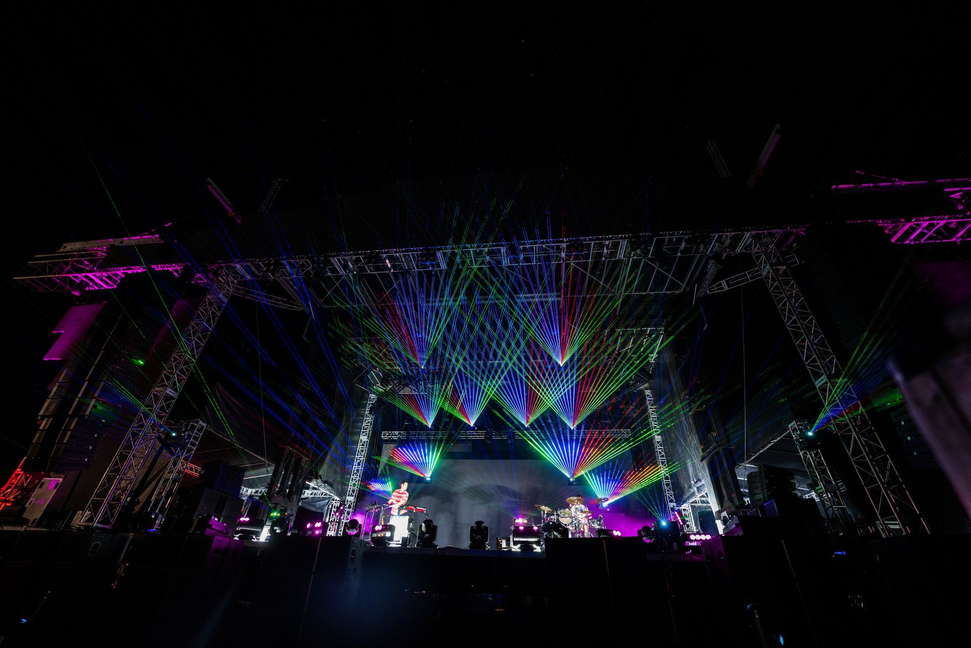 A large stage with a lot of lights on it at night.