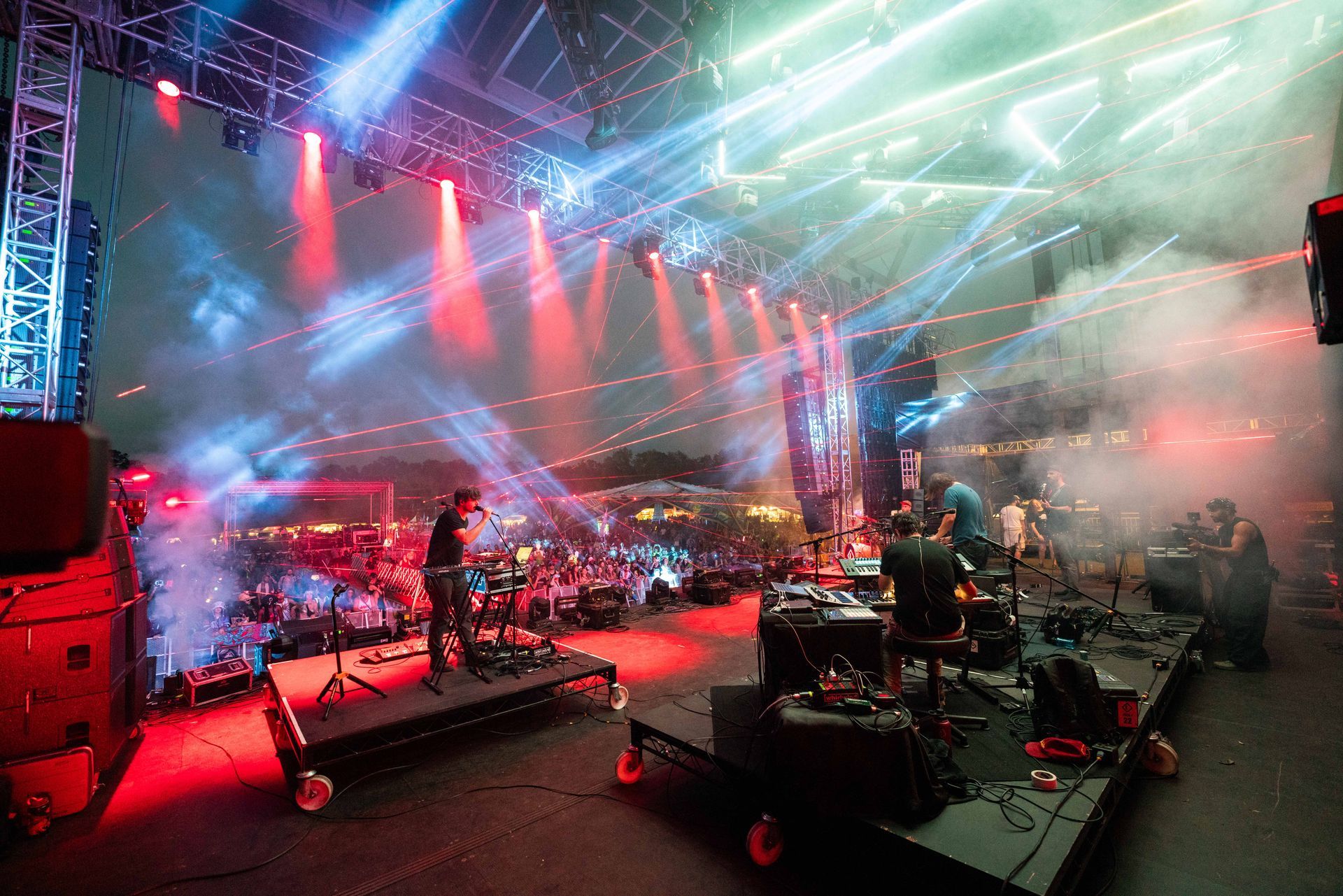 A group of people are playing instruments on a stage at a concert.