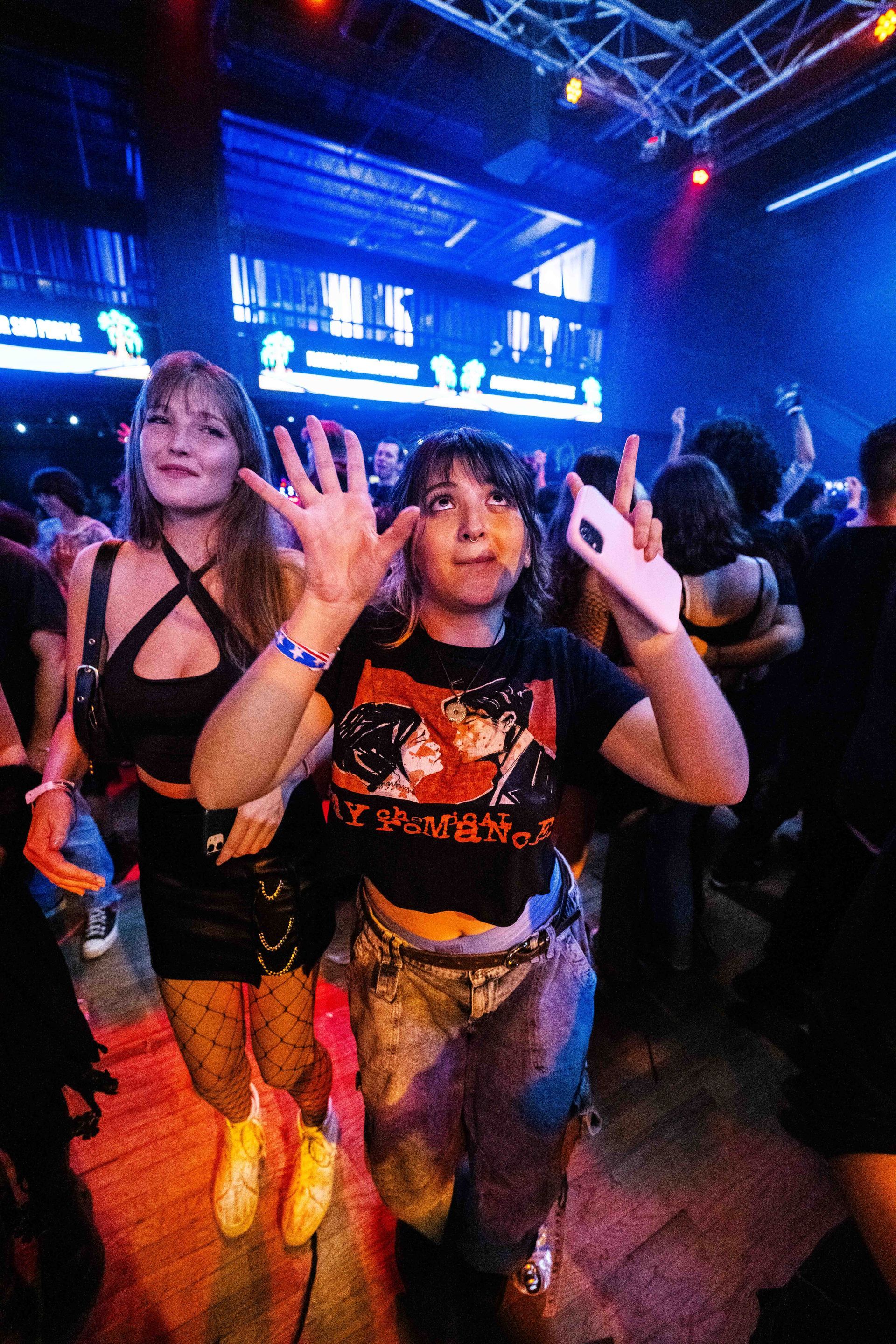 A group of people are dancing in a club.