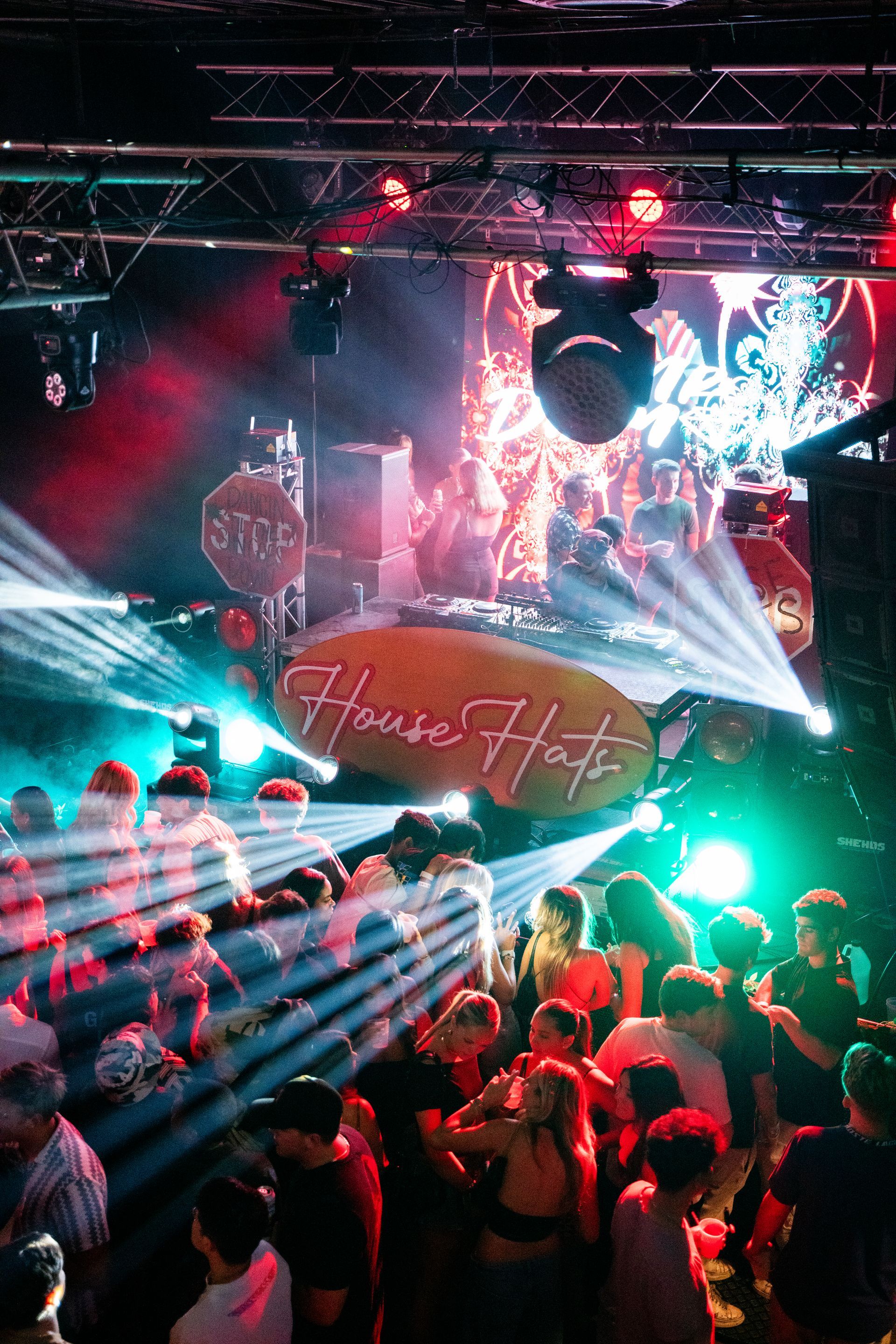 A large group of people are dancing in a club.