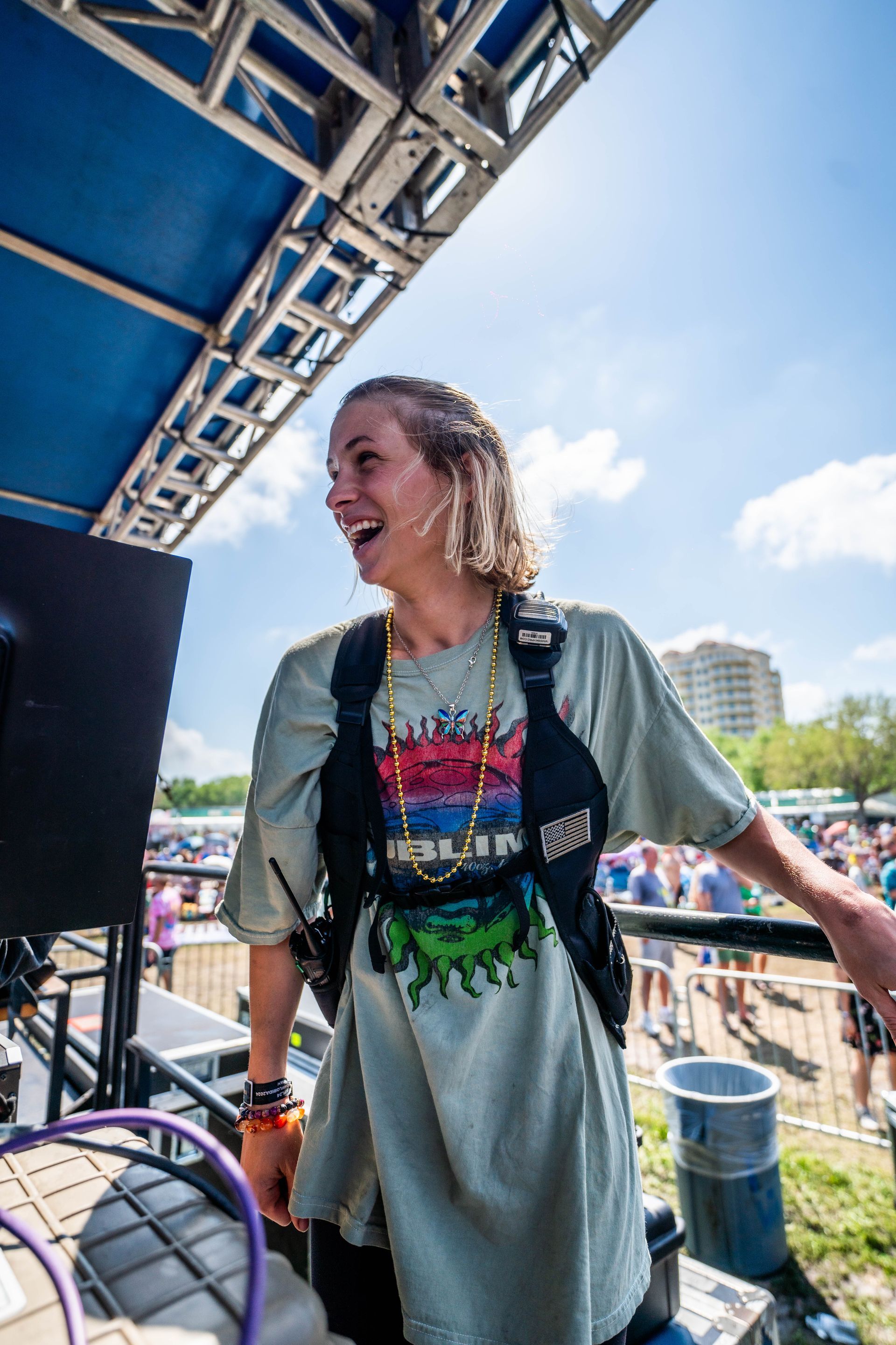 A woman is standing in front of a crowd at a concert.