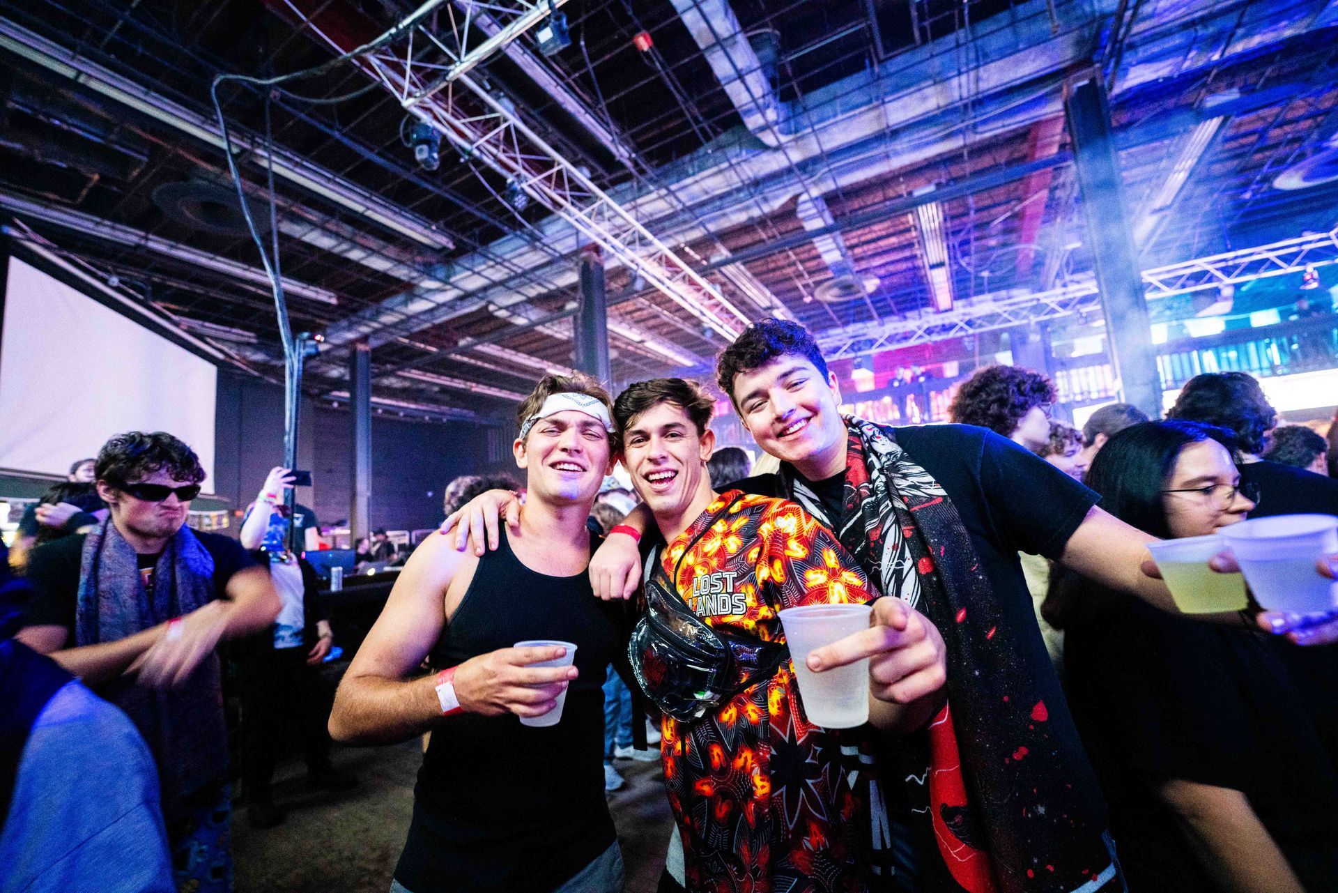 A group of people are posing for a picture at a party.