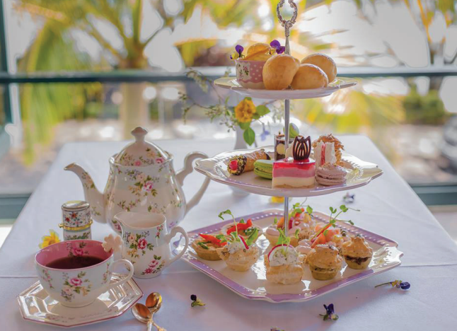 Afternoon Tea Table With Floral Teapot, Pink Tea — My Rainbow Bakery, Cafe & Catering in Cannonvale, QLD