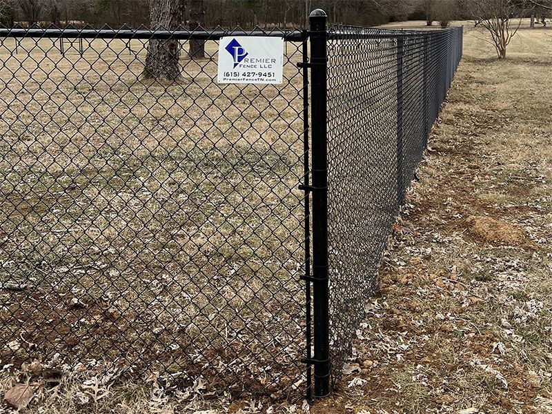 A chain link fence with a sign that says rescue on it