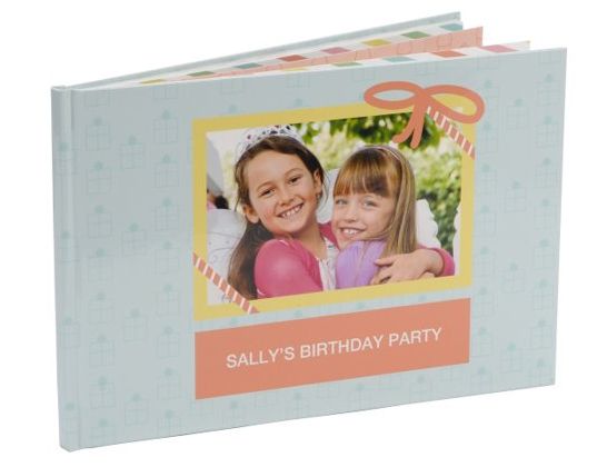Birthday party photo album with pastel cover, two smiling children, and pink balloon decorations