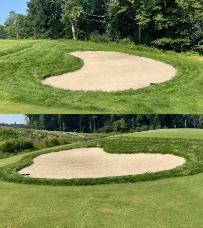 Two golf course sand traps, one above the other, both surrounded by green grass.