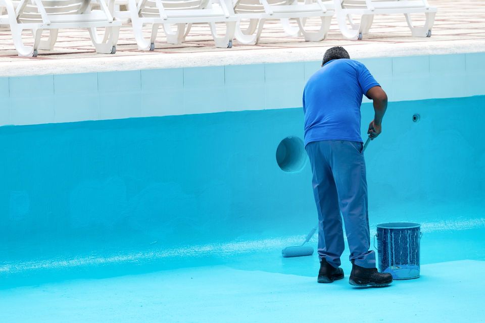 Pool Restoration Professional Working on drained pool