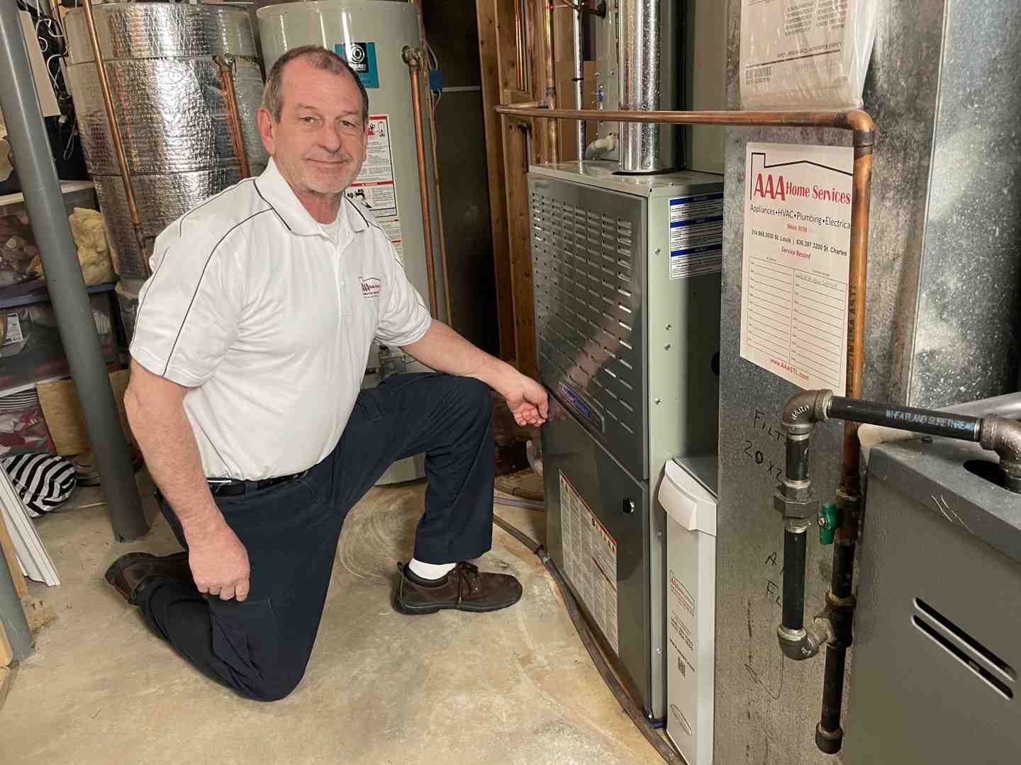 HVAC technician measuring ductwork for proper AC sizing - AC Installation Chesterfield