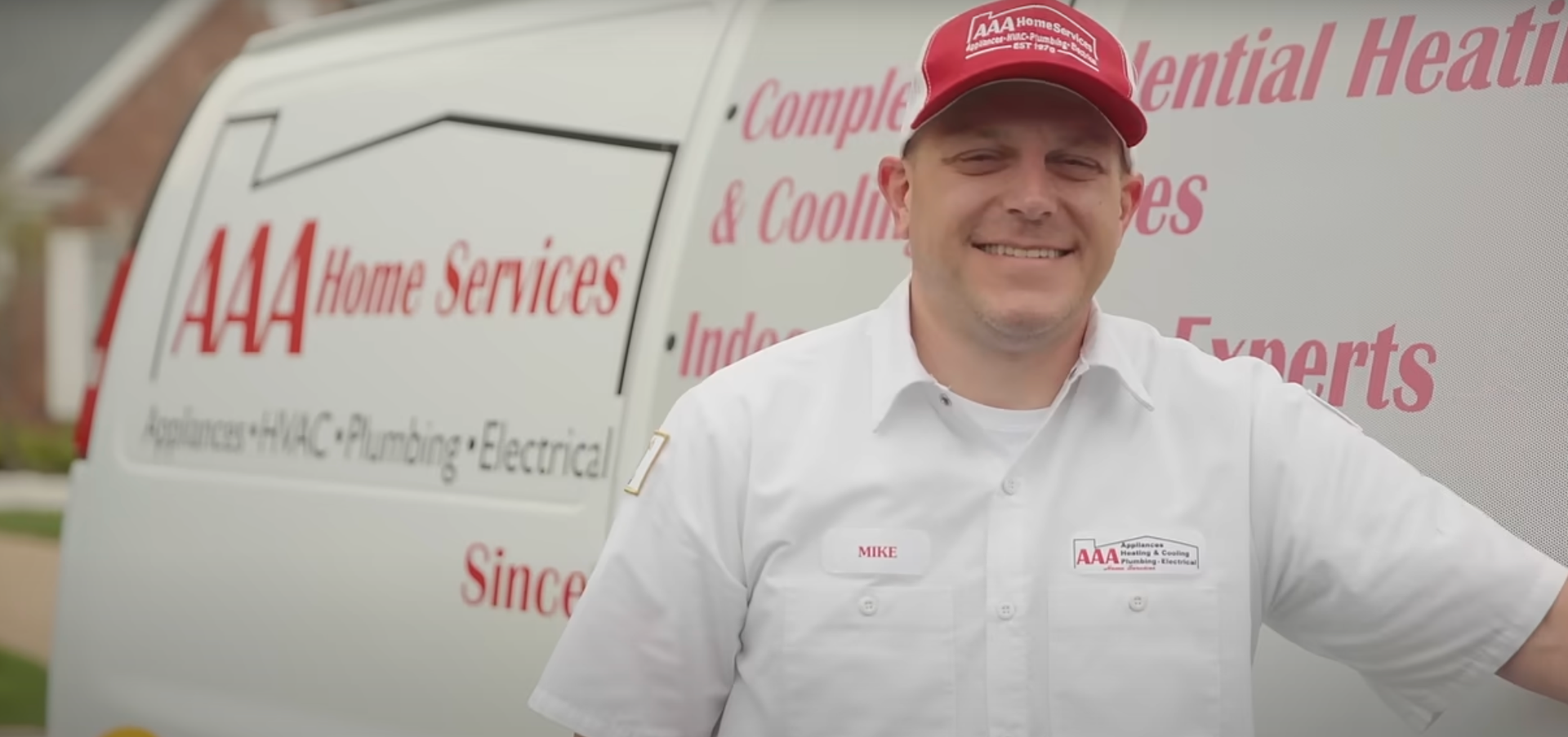 friendly AAA Home Services technician smiling at the camera - home heating and cooling friendly AAA Home Services technician smiling at the camera - home heating and cooling