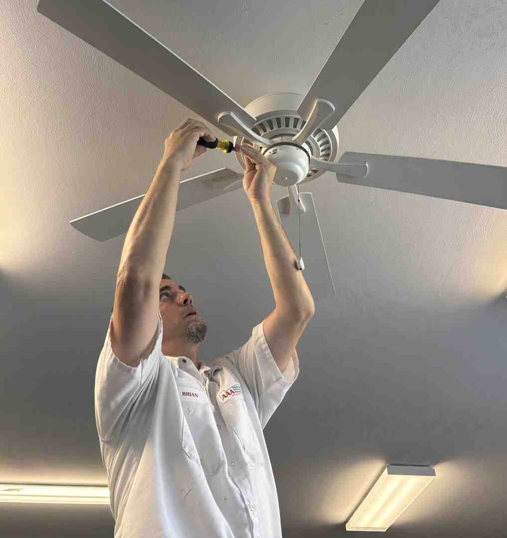 electrician installing a new light fixture - what do residential electricians do electrician installing a new light fixture - what do residential electricians do